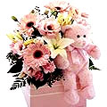 Fresh and bright Flowers and a cute Teddy Bear...