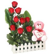 Breathtaking Nine Red Roses with a Teddy with Heart with Loving Embraces Breathtaking Nine Red Roses with a Teddy with Heart with Loving Embraces