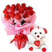 Cute Teddy Bear with a Cluster of Red Roses Cute Teddy Bear with a Cluster of Red Roses