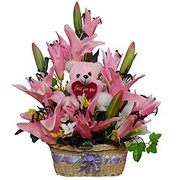 Bright Artificial Flowers with Teddy in a Basket Bright Artificial Flowers with Teddy in a Basket