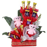 Delectable Collection of Cadbury Chocolates with Pink Teddies in a Basket Delectable Collection of Cadbury Chocolates with Pink Teddies in a Basket