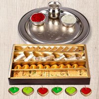 Silver Puja Thali, Diya N Haldirams Assorted Sweets. Silver Puja Thali, Diya N Haldirams Assorted Sweets.