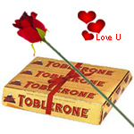 Toblerone Swiss make (200 gms) with One Velvet Red Rose Toblerone Swiss make (200 gms) with One Velvet Red Rose