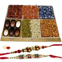 Garnished Menu Dry Fruit and Chocolate Platter with Two Rakhis and Roli Tilak Chawal Garnished Menu Dry Fruit and Chocolate Platter with Two Rakhis and Roli Tilak Chawal