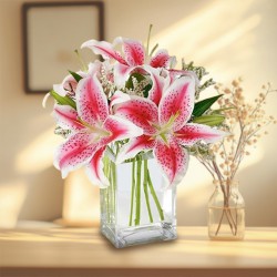 Pretty assemble of Pink Lilies in Glass Vase Pretty assemble of Pink Lilies in Glass Vase