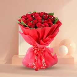 Flowering Selection of Red Color Roses artfully wrapped in Tissue Flowering Selection of Red Color Roses artfully wrapped in Tissue