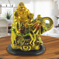 Laughing budha sitting on elephant Laughing budha sitting on elephant