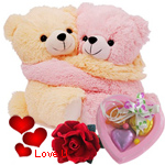 Cute Hugging Couple Teddy with 1 Velvet Rose and 3 pcs Heart Homemade Chocolate Cute Hugging Couple Teddy with 1 Velvet Rose and 3 pcs Heart Homemade Chocolate