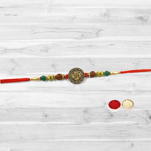 Resplendent Rakhi with a Swastik at the Center Resplendent Rakhi with a Swastik at the Center
