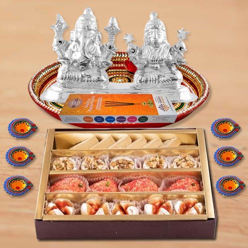 Diwali Puja Thali Hamper with Assorted sweets from Haldirams and Silver Plated Ganesh Lakshmi Diwali Puja Thali Hamper with Assorted sweets from Haldirams and Silver Plated Ganesh Lakshmi