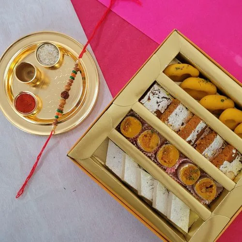 Fantastic Rudraksha Rakhi with Sweets  N  Golden Rakhi Thali Combo