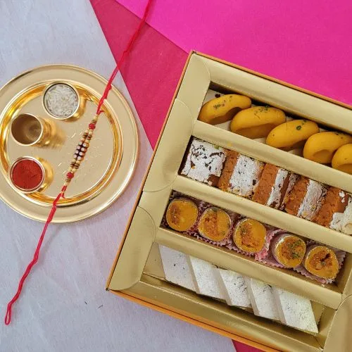 Impressive Stone Rakhi  N  Assorted Sweets with Golden Rakhi Thali